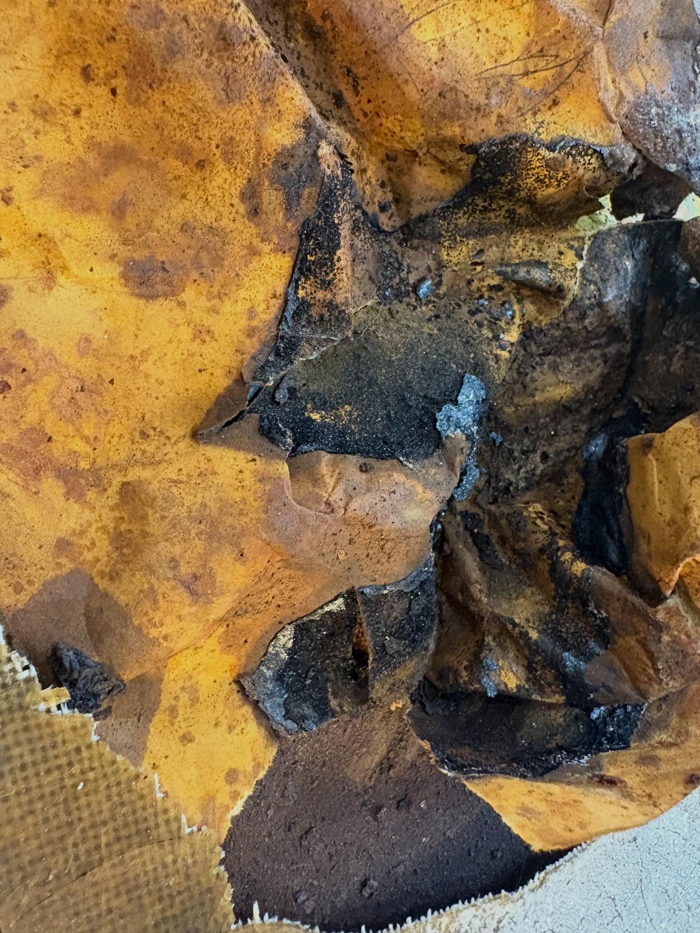 Layered paper and rust detail by Sarah Hughes, 2026